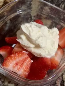 whipped cream on strawberries